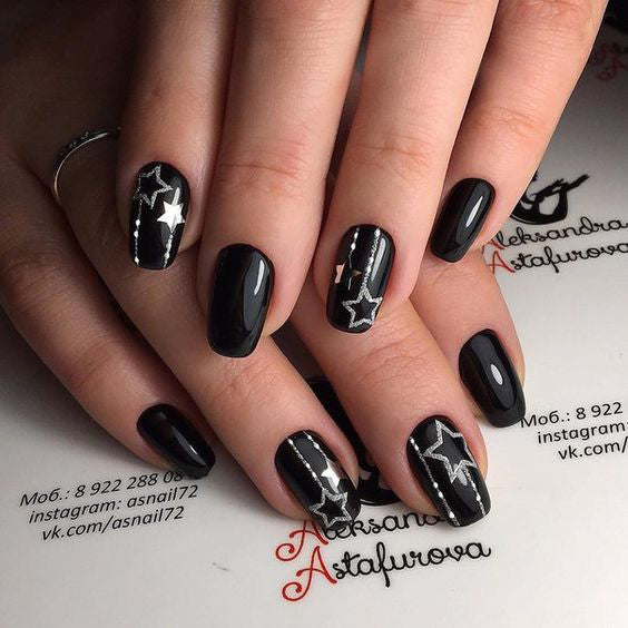 99+ Trending Black Nails Art Manicure Ideas; Black coffin nails; Black acrylic nails; long Black gel nail; short Black nails; Black cute nails; Black matte nails; Black glitter nails.