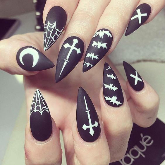 Best Black Stiletto Nails Designs For Your Halloween； Black nails; black stiletto nails; black and white; stiletto nails; long nails; nails addict; nails magazine; gothic nails; Halloween nails