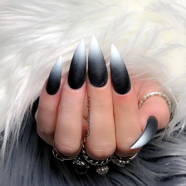 <img src="//cdn.shopify.com/s/files/1/2375/3611/files/black_stiletto_nails30.jpg?v=1538229545" alt="&lt;img src=&quot;//cdn.shopify.com/s/files/1/2375/3611/files/black_stiletto_nails1.jpg?v=1538229033&quot; alt=&quot;Best Black Stiletto Nails Designs For Your Halloween； Black nails; black stiletto nails; black and white; stiletto nails; long nails; nails addict; nails magazine; gothic nails; Halloween nails