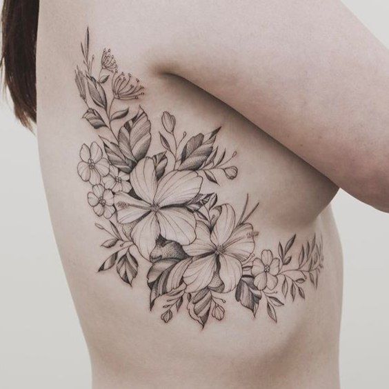 45 Charming and Irresistible Rib Tattoos Designs